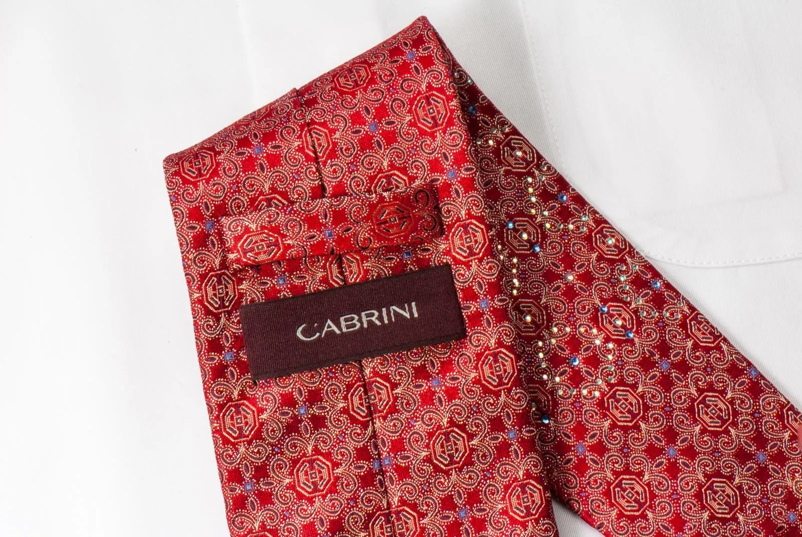 Cabrini Rhinestone Silk Tie Fleur De Lis Motif On Red With Silver Sparkles